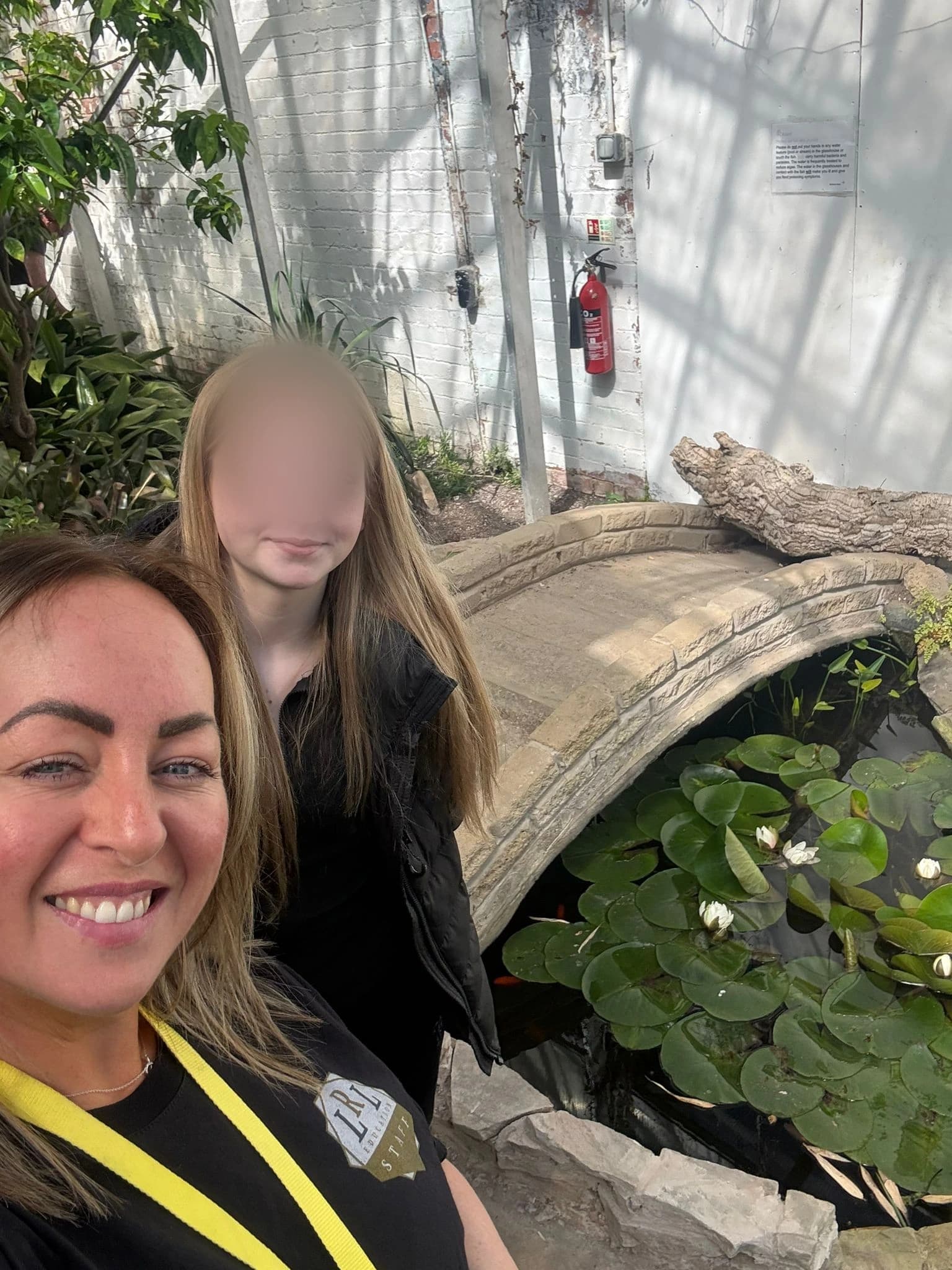An LRL staff member and anonymised learner during a supported greenhouse visit.