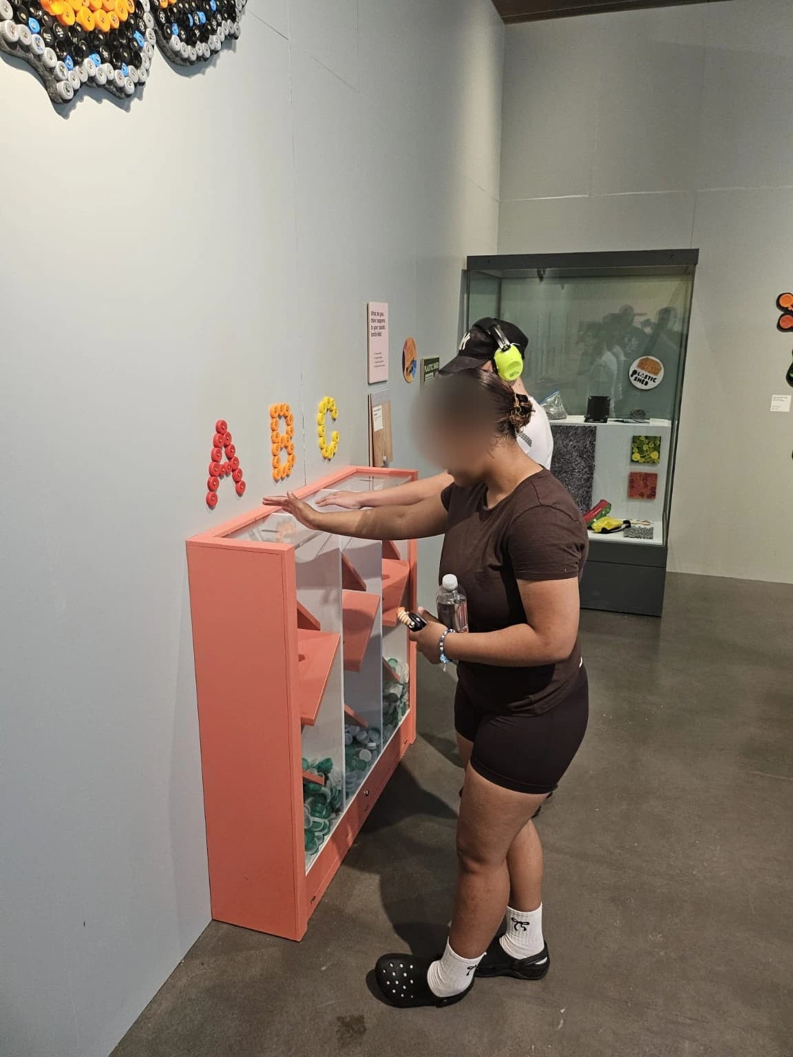 Learners engaging with an interactive museum exhibit.